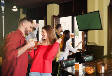 Group of football fans in sport bar