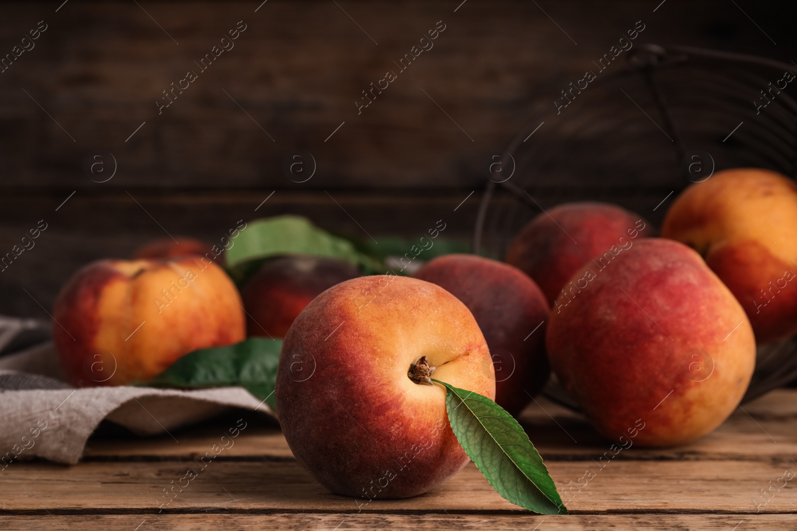 Photo of Fresh ripe juicy peaches on wooden table