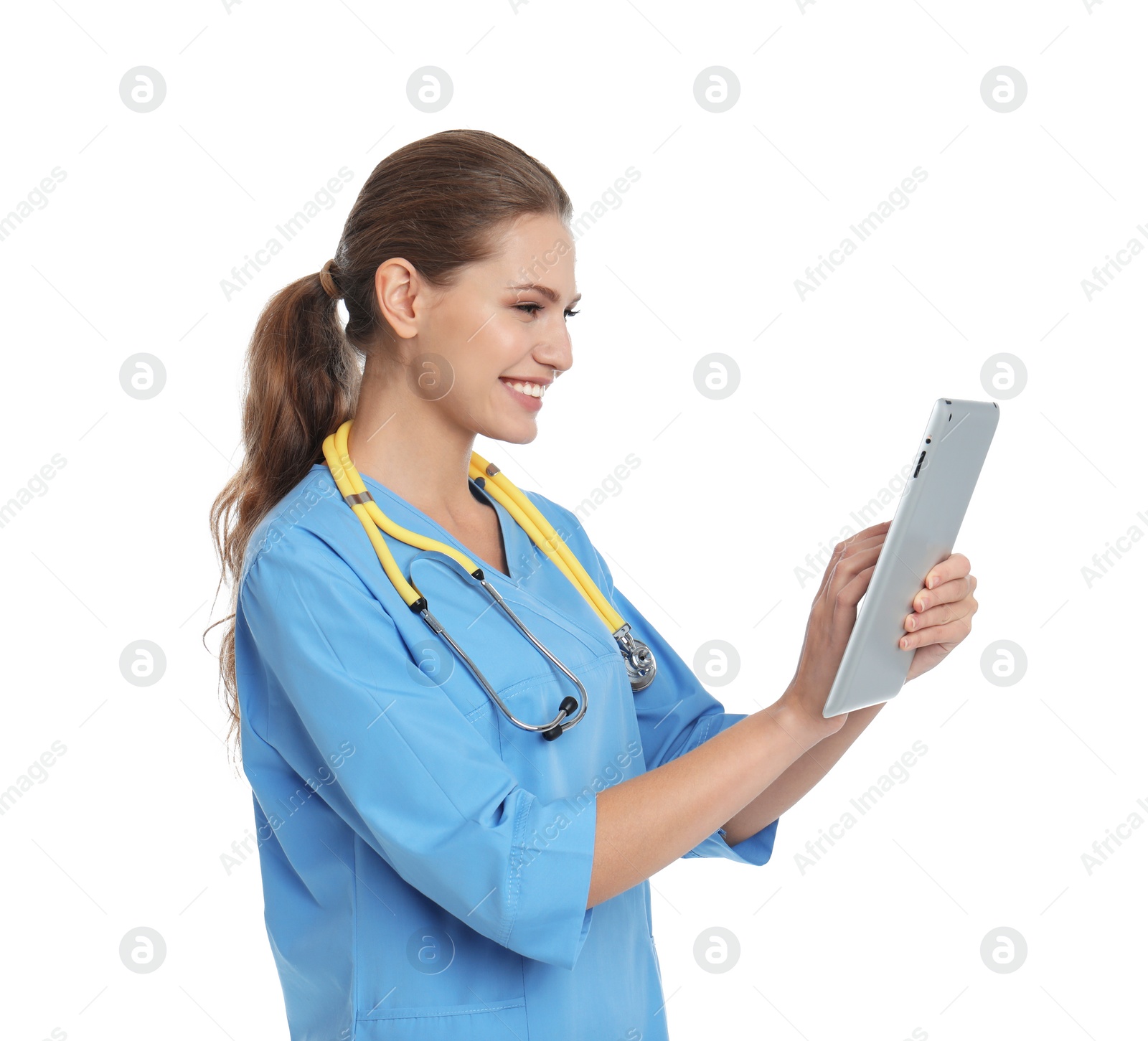 Photo of Portrait of young medical assistant with stethoscope and tablet on white background
