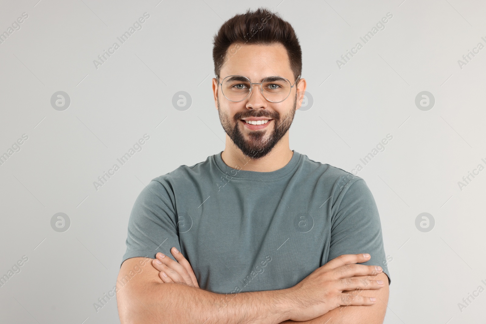 Photo of Handsome man wearing glasses on light gray background