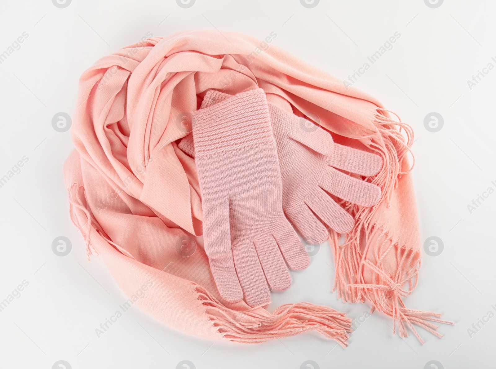 Photo of Stylish gloves and scarf on white background, top view. Autumn clothes