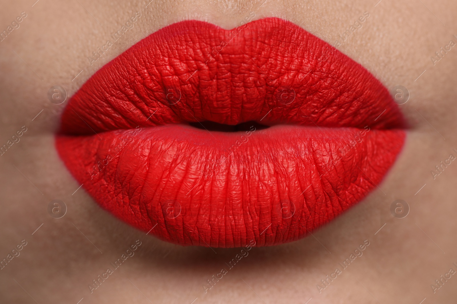 Photo of Closeup view of beautiful woman puckering lips for kiss