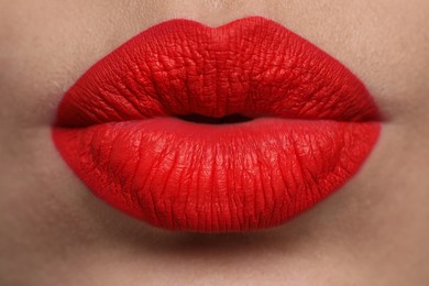 Photo of Closeup view of beautiful woman puckering lips for kiss