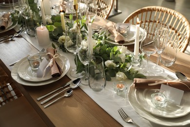 Photo of Elegant table setting with beautiful floral decor and burning candles