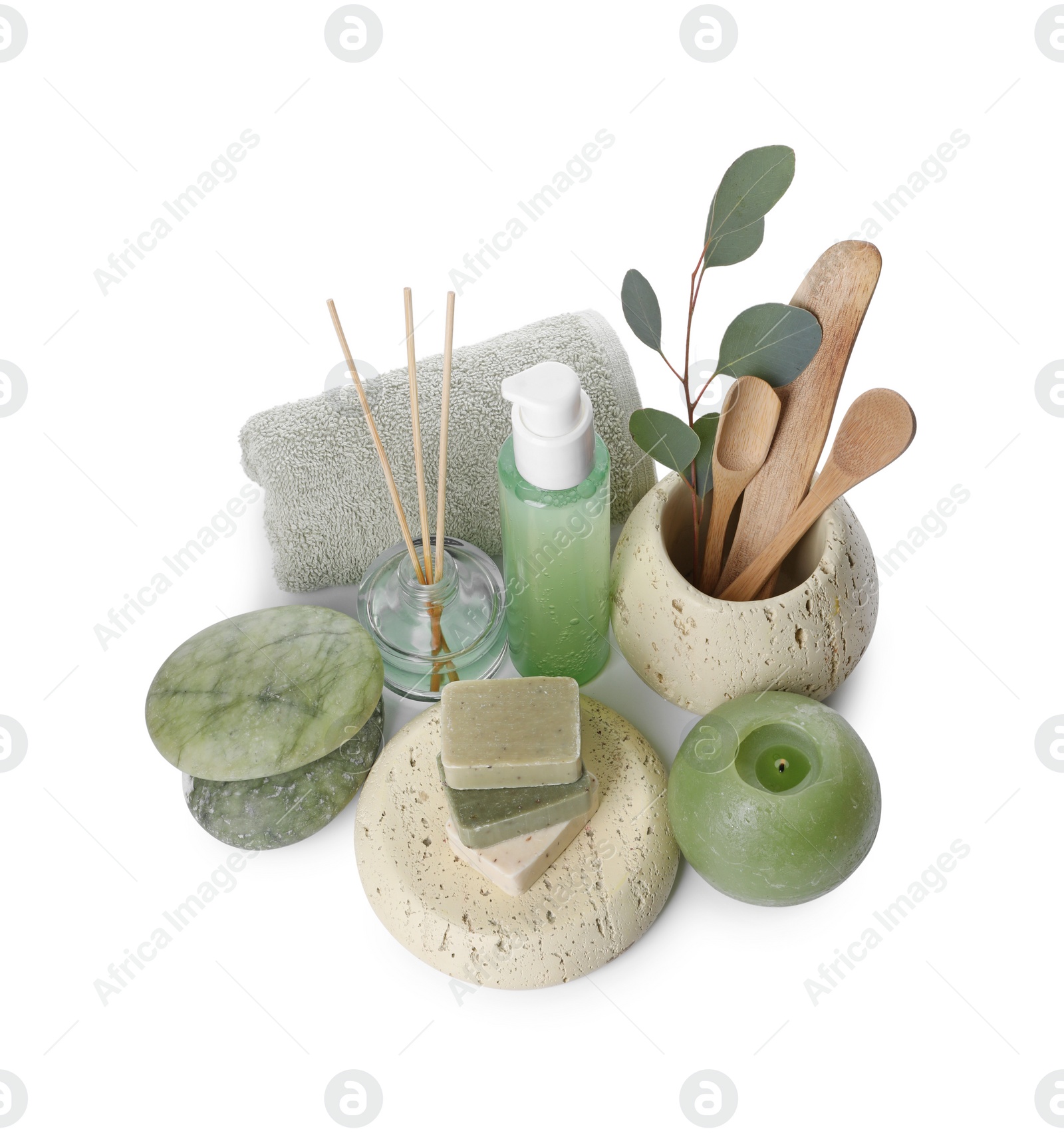 Photo of Composition with spa products, reed air freshener, candle and eucalyptus branch isolated on white