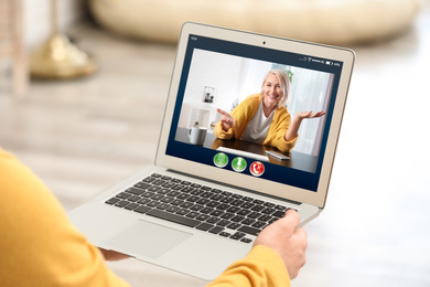 Image of Distance learning, online school lesson. Girl studying at home during quarantine and lockdown due to Covid-19 pandemic, closeup