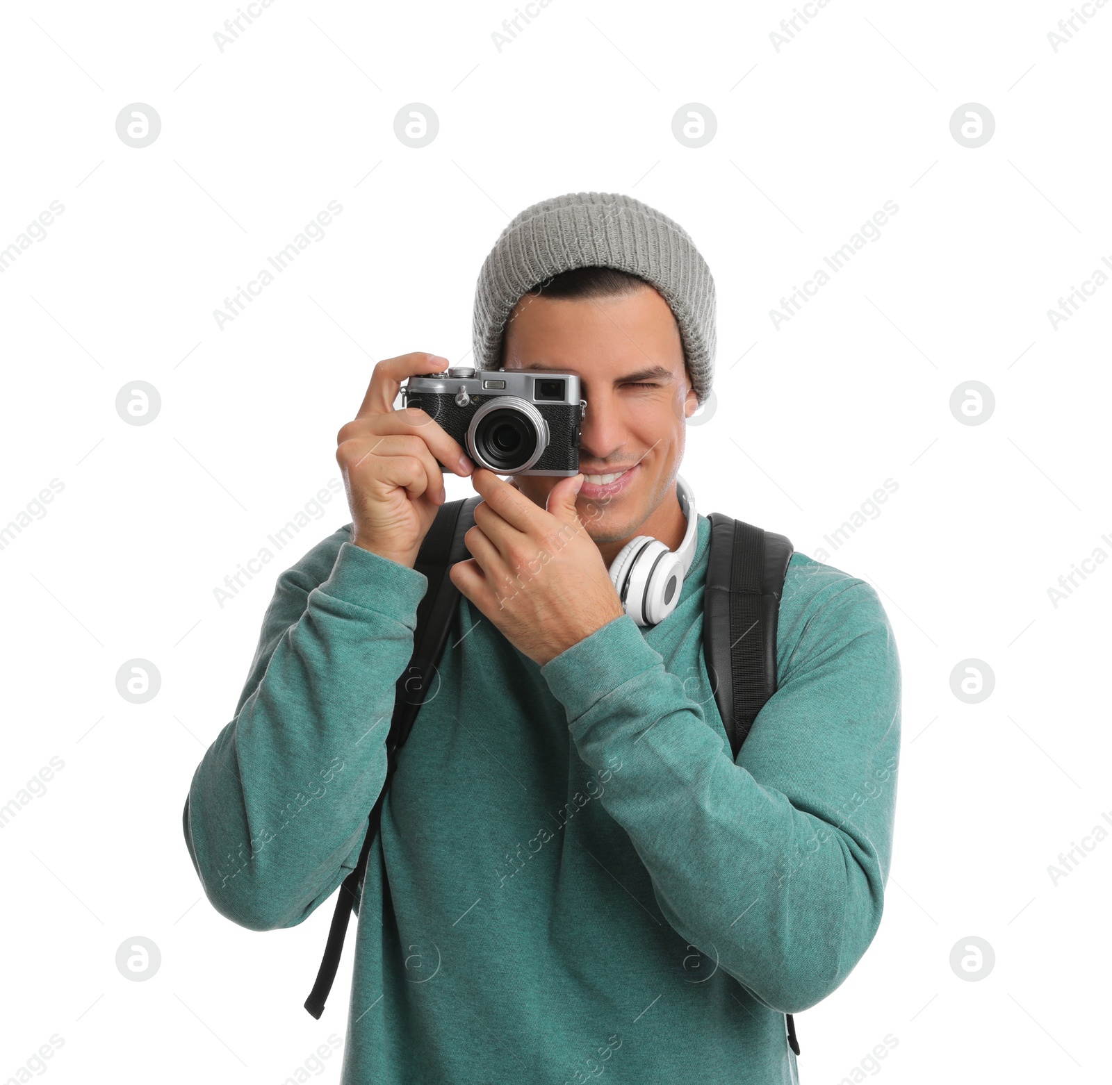 Photo of Man with backpack taking picture on white background. Autumn travel