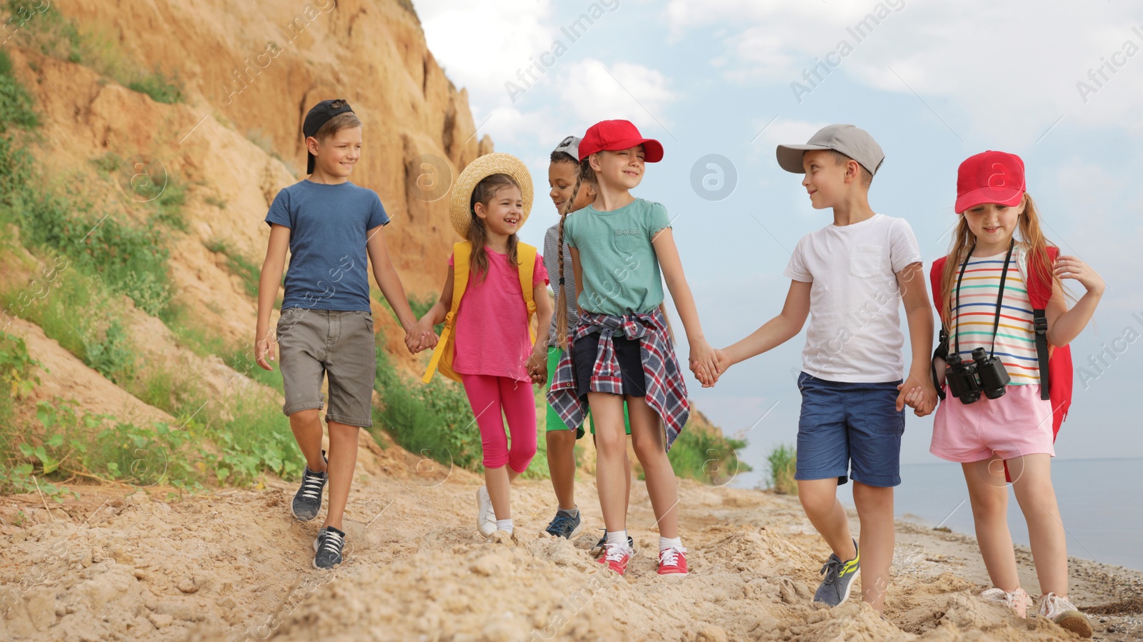 Photo of Cute little children outdoors on summer day. Camping trip