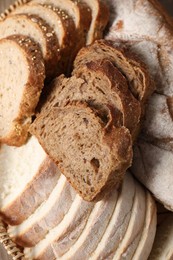 Photo of Different types of fresh bread, above view