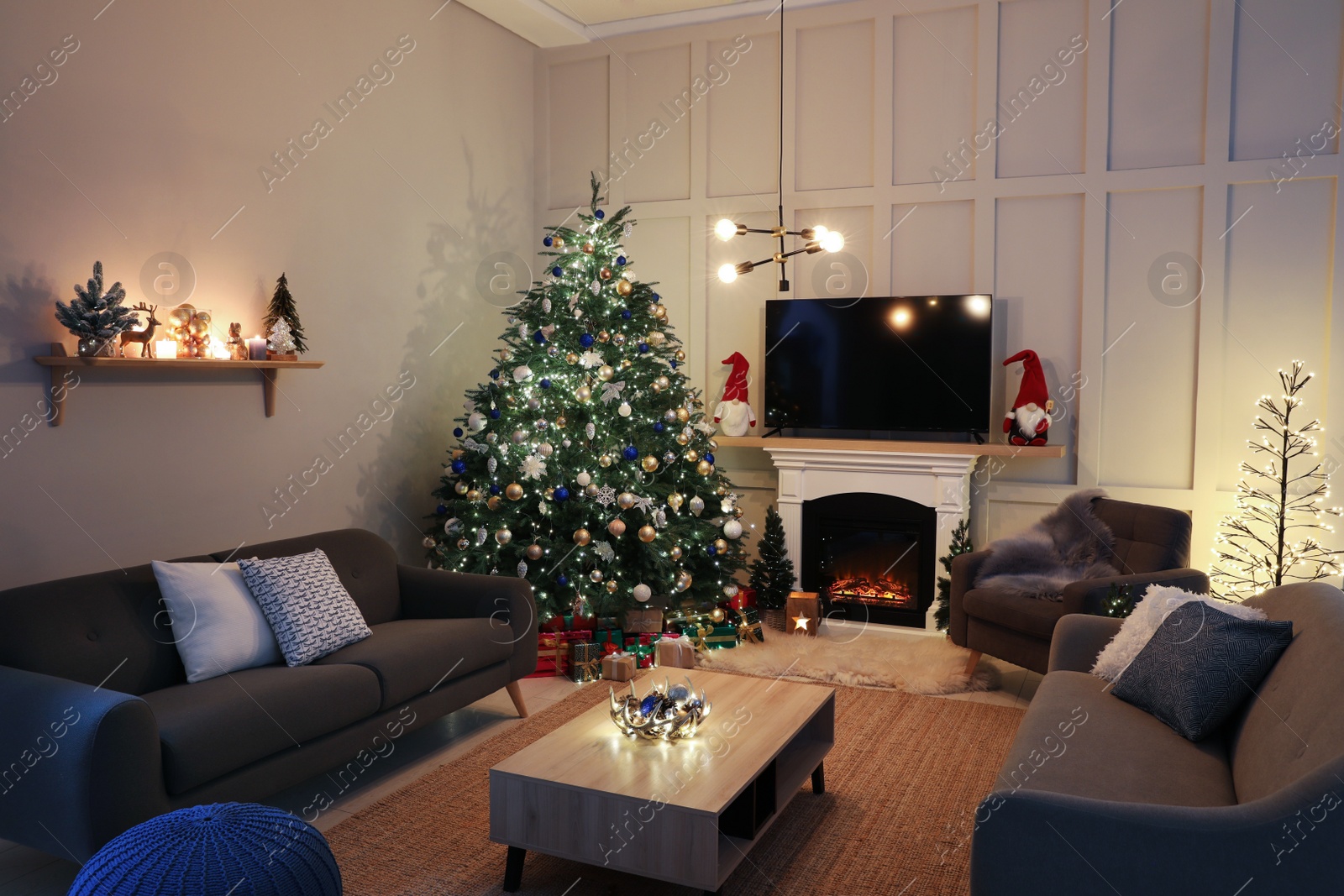 Photo of Cozy living room interior with beautiful Christmas tree near fireplace