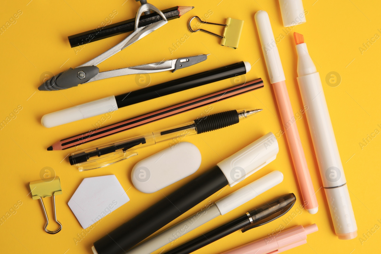 Photo of Flat lay composition with different school stationery on orange background. Back to school