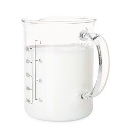 Fresh milk in measuring cup isolated on white