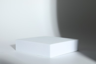 Photo of Presentation of product. Podium on white background, space for text