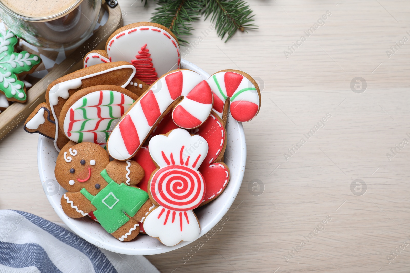 Photo of Delicious Christmas cookies on wooden table, flat lay. Space for text