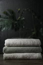 Stacked terry towels on table in bathroom