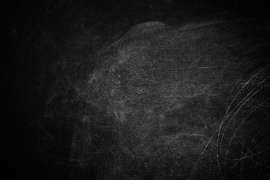 Photo of Chalk rubbed out on blackboard as background. Space for text