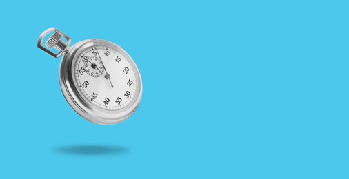 Concept of time. Vintage timer in air on light blue background, banner design. Space for text