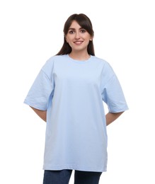 Smiling woman in stylish light blue t-shirt on white background