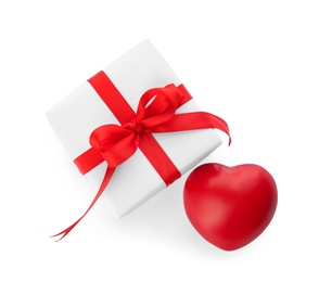 Photo of Beautiful gift box and red heart on white background, top view. Valentine's day celebration