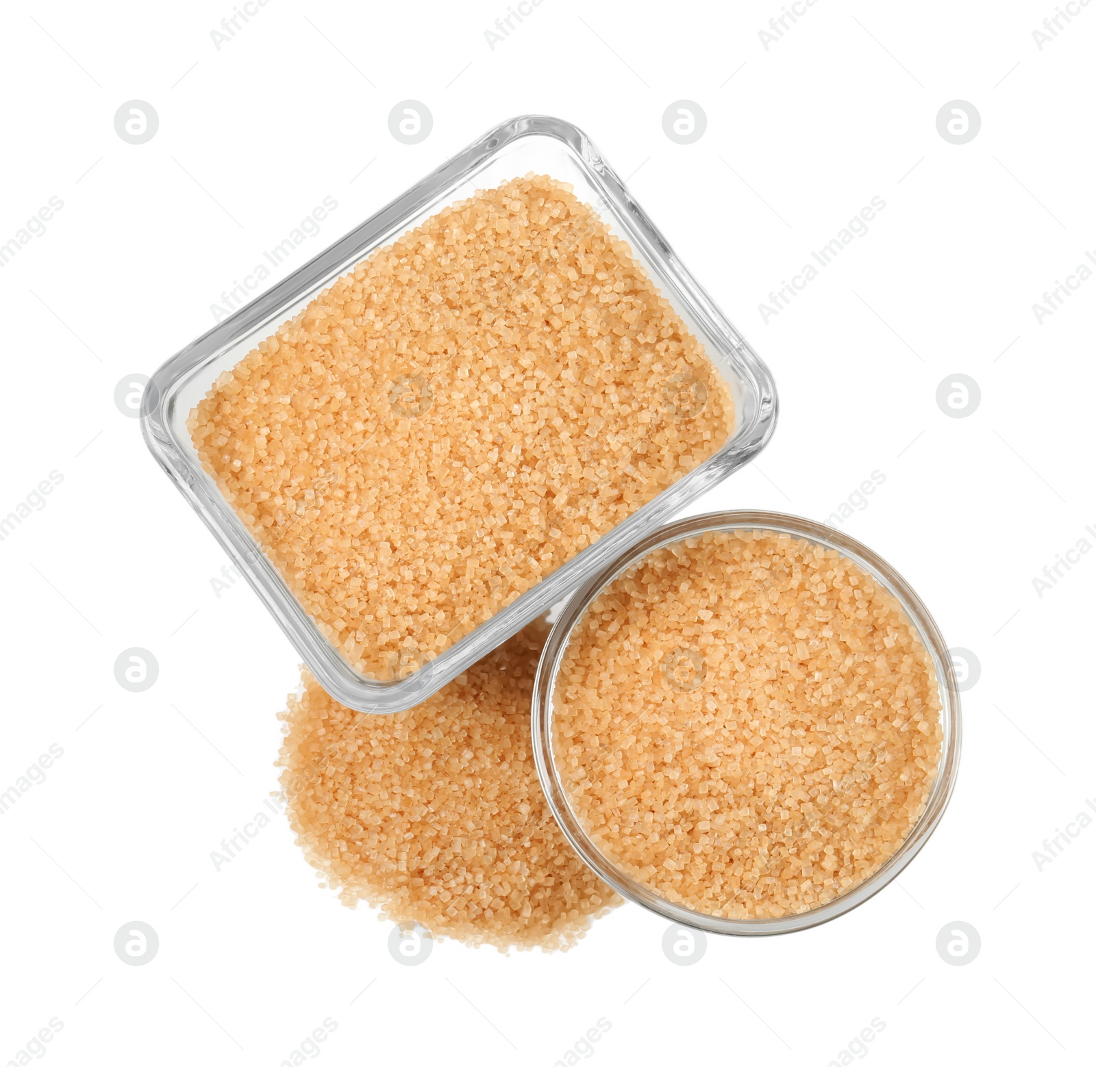 Photo of Brown sugar in glass bowls isolated on white, top view