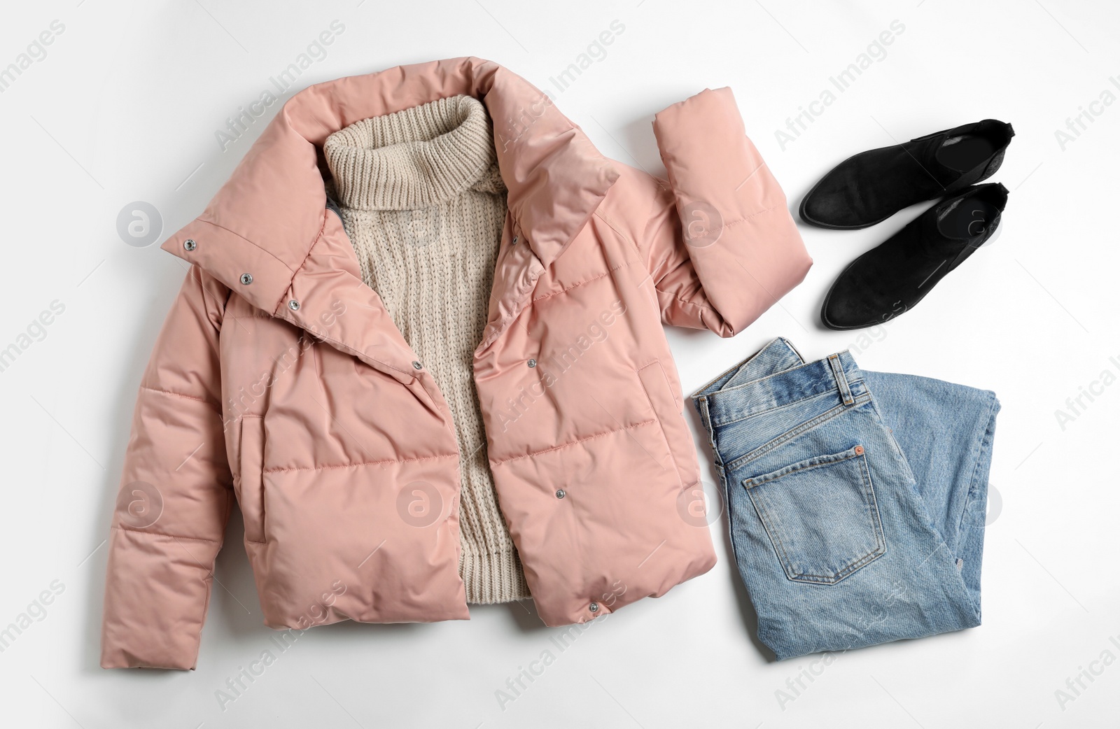 Photo of Flat lay composition with female winter clothes on white background