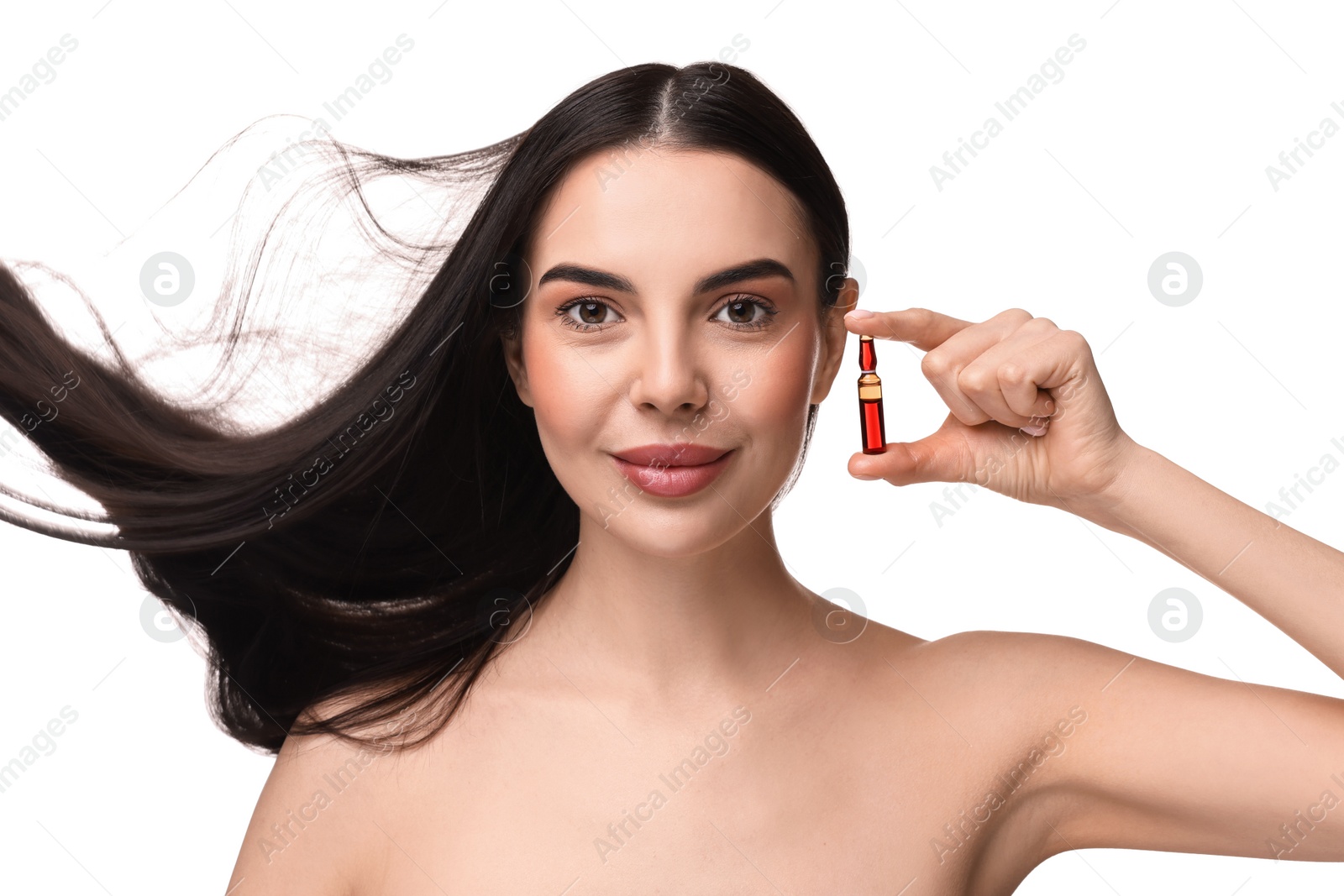 Photo of Beautiful young woman with long healthy hair holding ampoule on white background