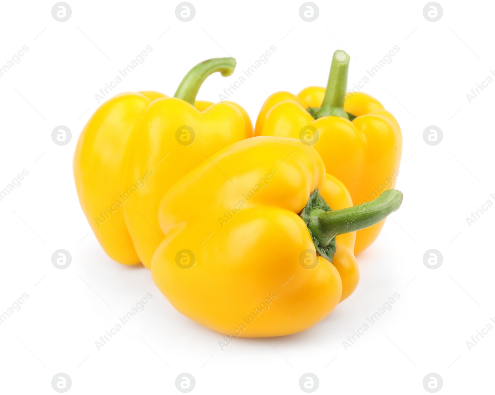 Photo of Ripe yellow bell peppers isolated on white