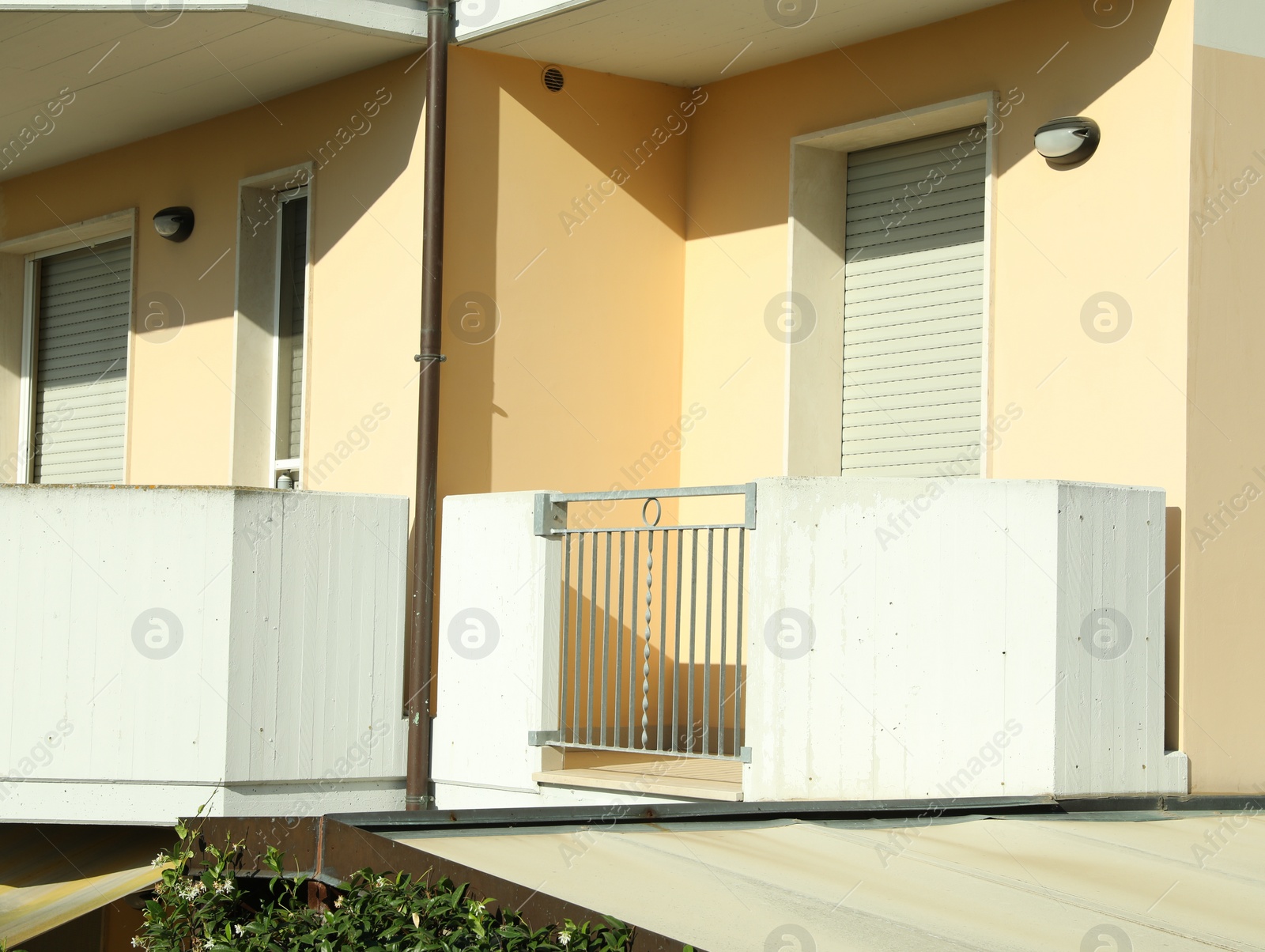 Photo of Modern residential building with balconies on sunny day