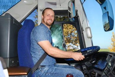 Professional bus driver at steering wheel. Passenger transportation