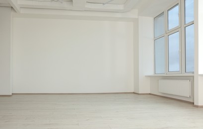 Photo of New empty room with clean windows and white walls