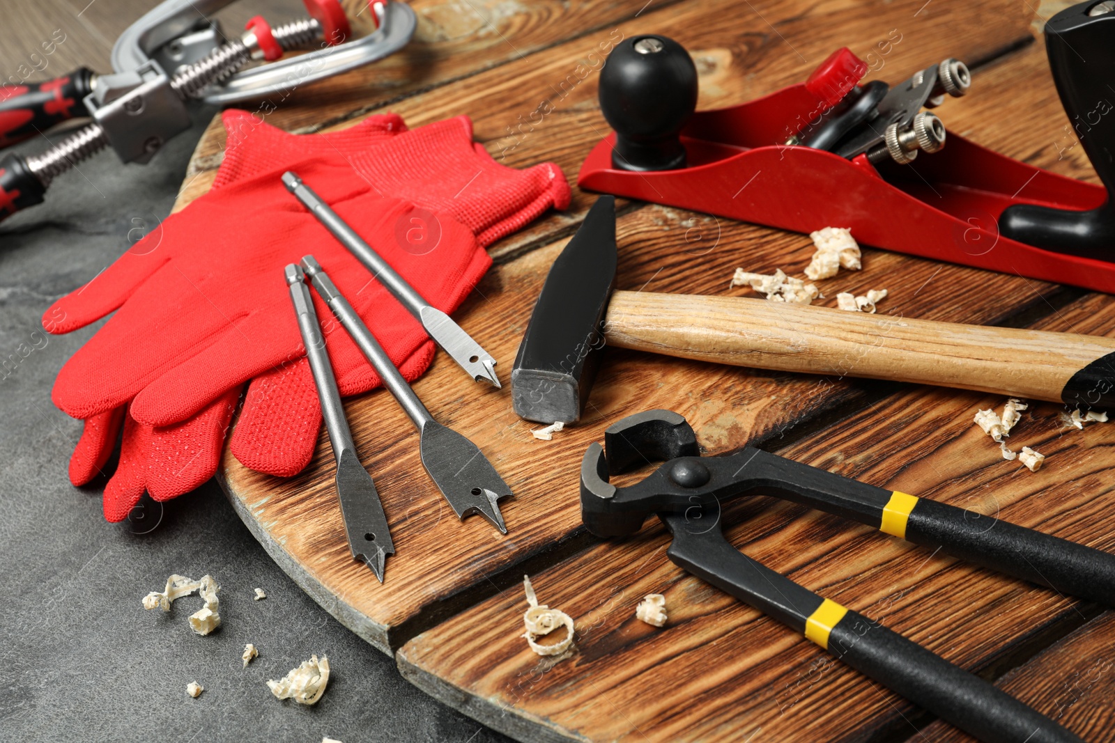 Photo of Set of modern carpenter's tools on grey table