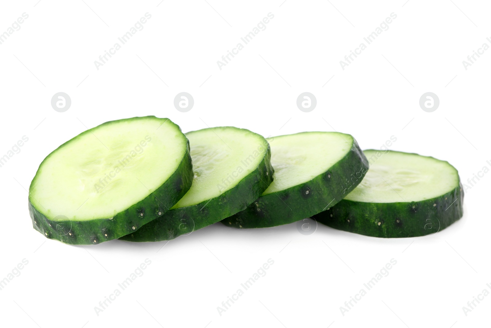 Photo of Slices of fresh cucumber on white background