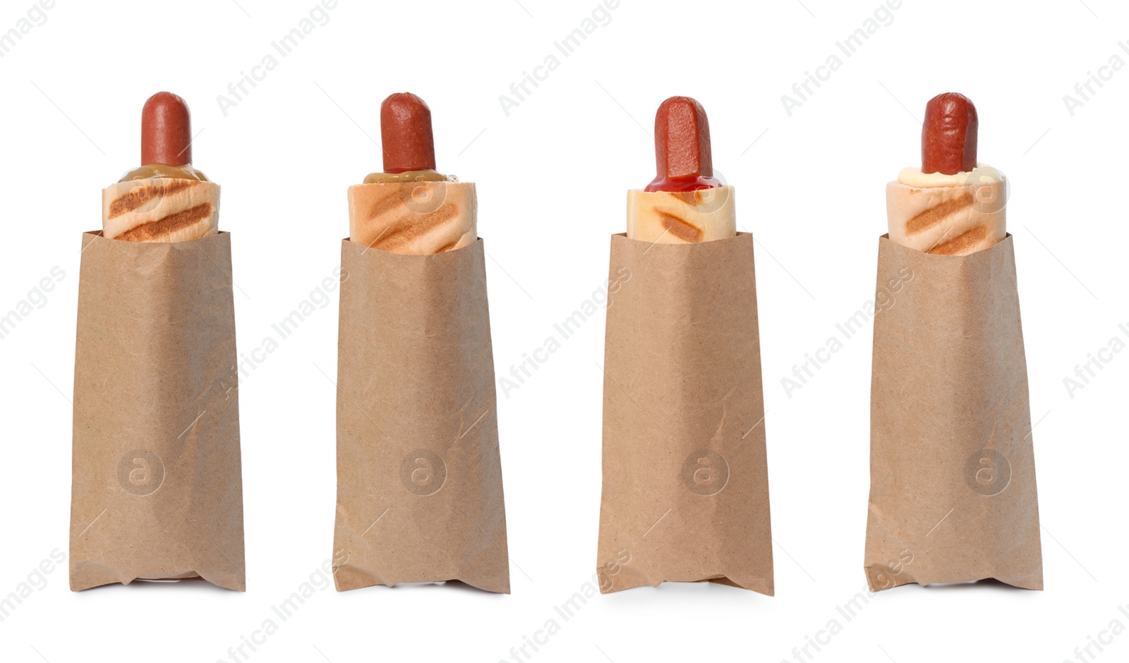 Image of Set of yummy French hot dogs with grilled buns and different sauces isolated on white