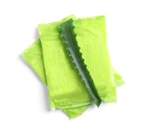 Photo of Menstrual pads and aloe leaf on white background, top view. Gynecological care