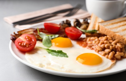 Photo of Tasty breakfast with fried eggs on table, closeup