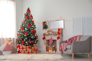 Stylish living room interior with decorated Christmas tree