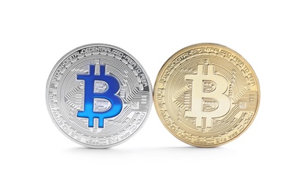 Shiny bitcoins isolated on white. Digital currency