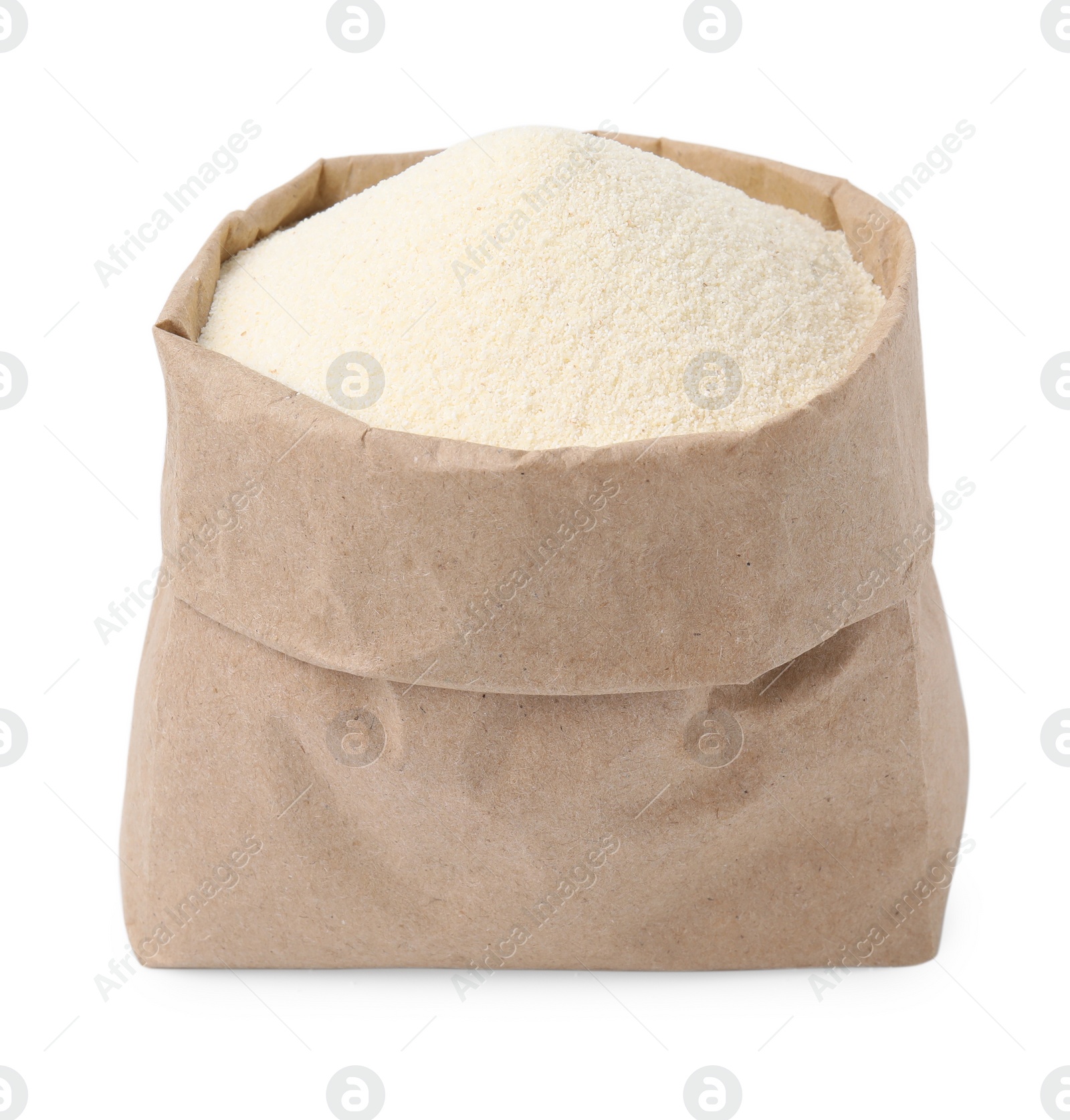 Photo of Paper bag with uncooked organic semolina isolated on white