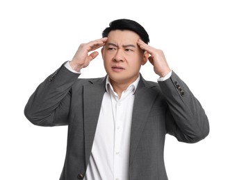 Photo of Tired businessman in suit suffering from headache on white background