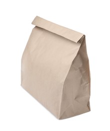 Photo of Closed kraft paper bag isolated on white