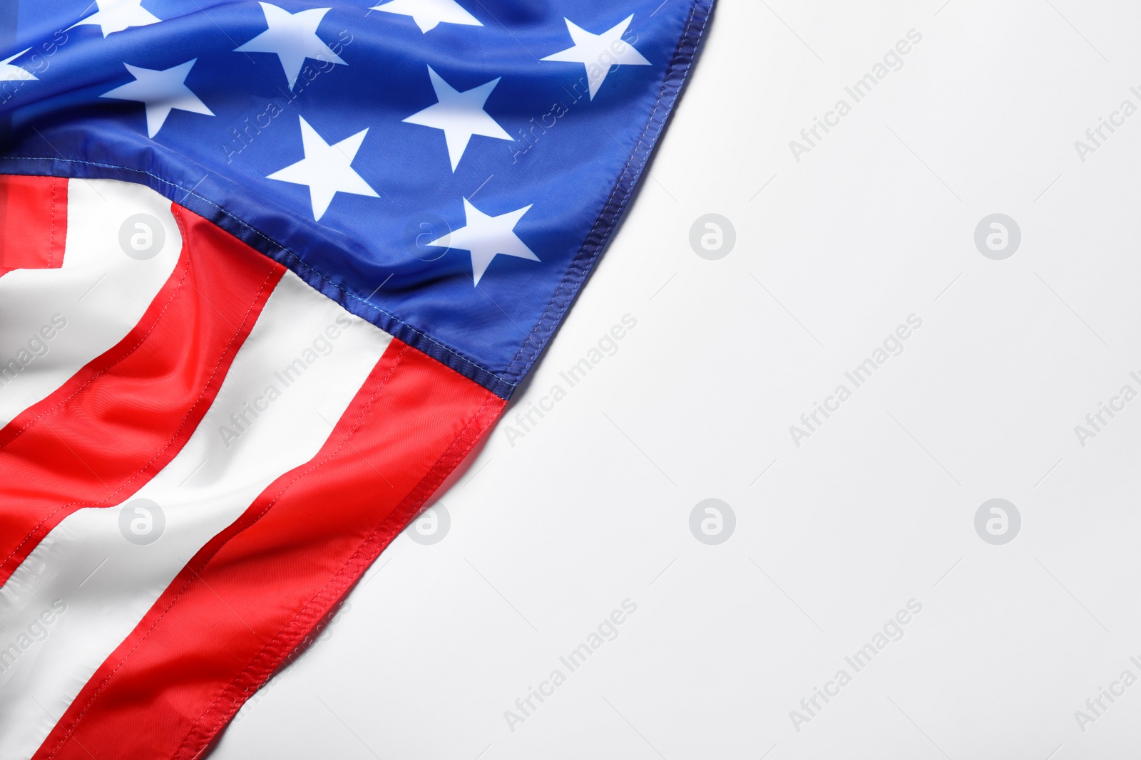 Photo of American flag on white background, top view