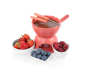 Photo of Fondue pot with melted chocolate, fresh berries and forks isolated on white