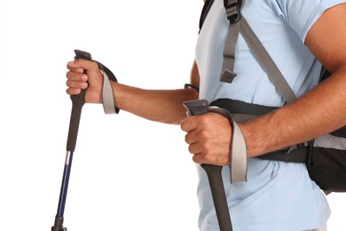 Male hiker with backpack and trekking poles on white background, closeup