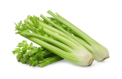 Photo of Fresh green celery bunches isolated on white