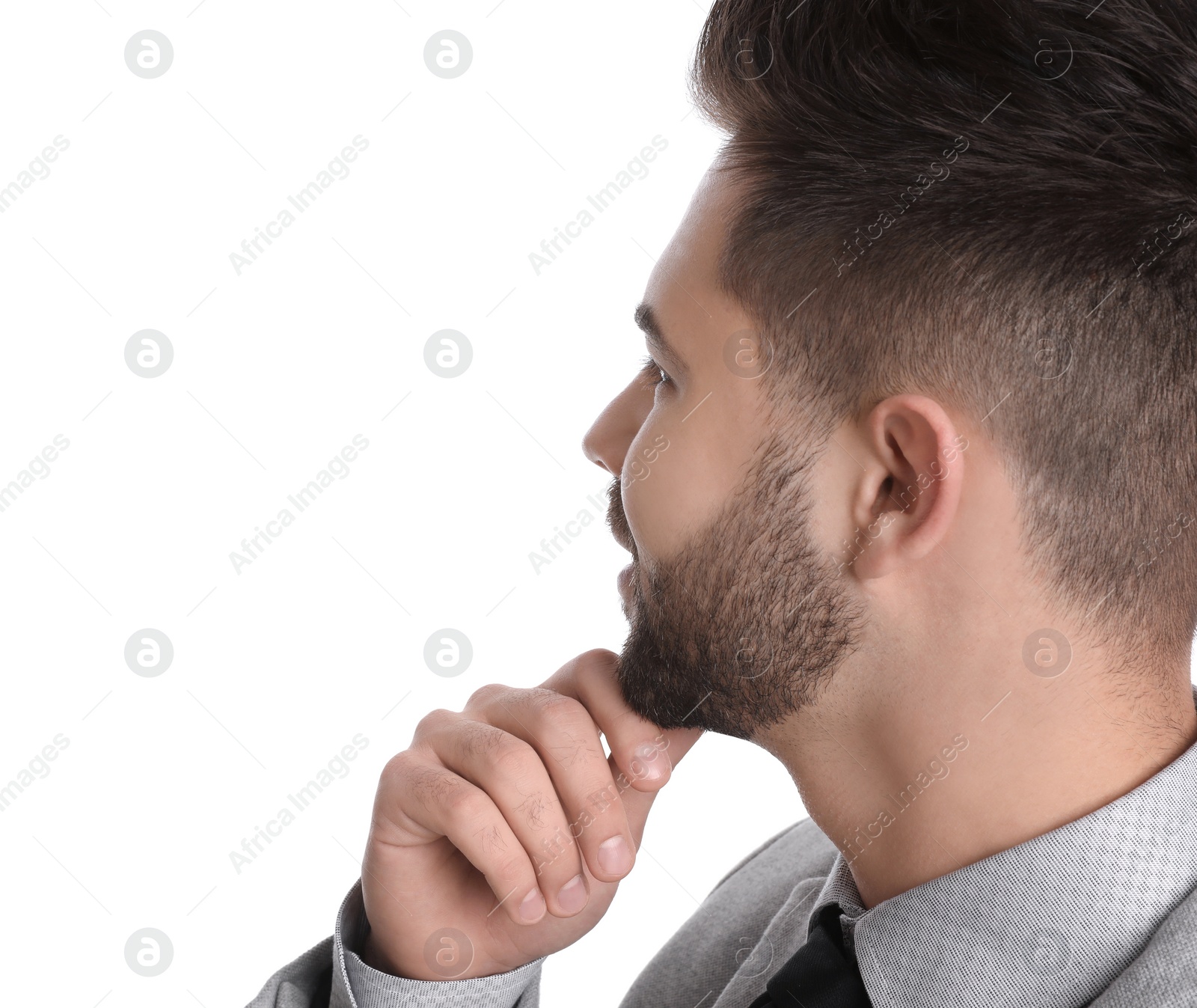 Photo of Young businessman in suit on white background, closeup