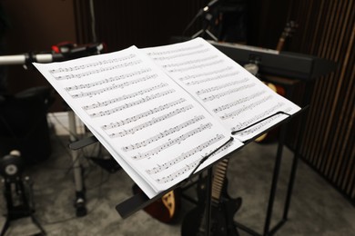 Note stand with music sheets at recording studio. Band practice