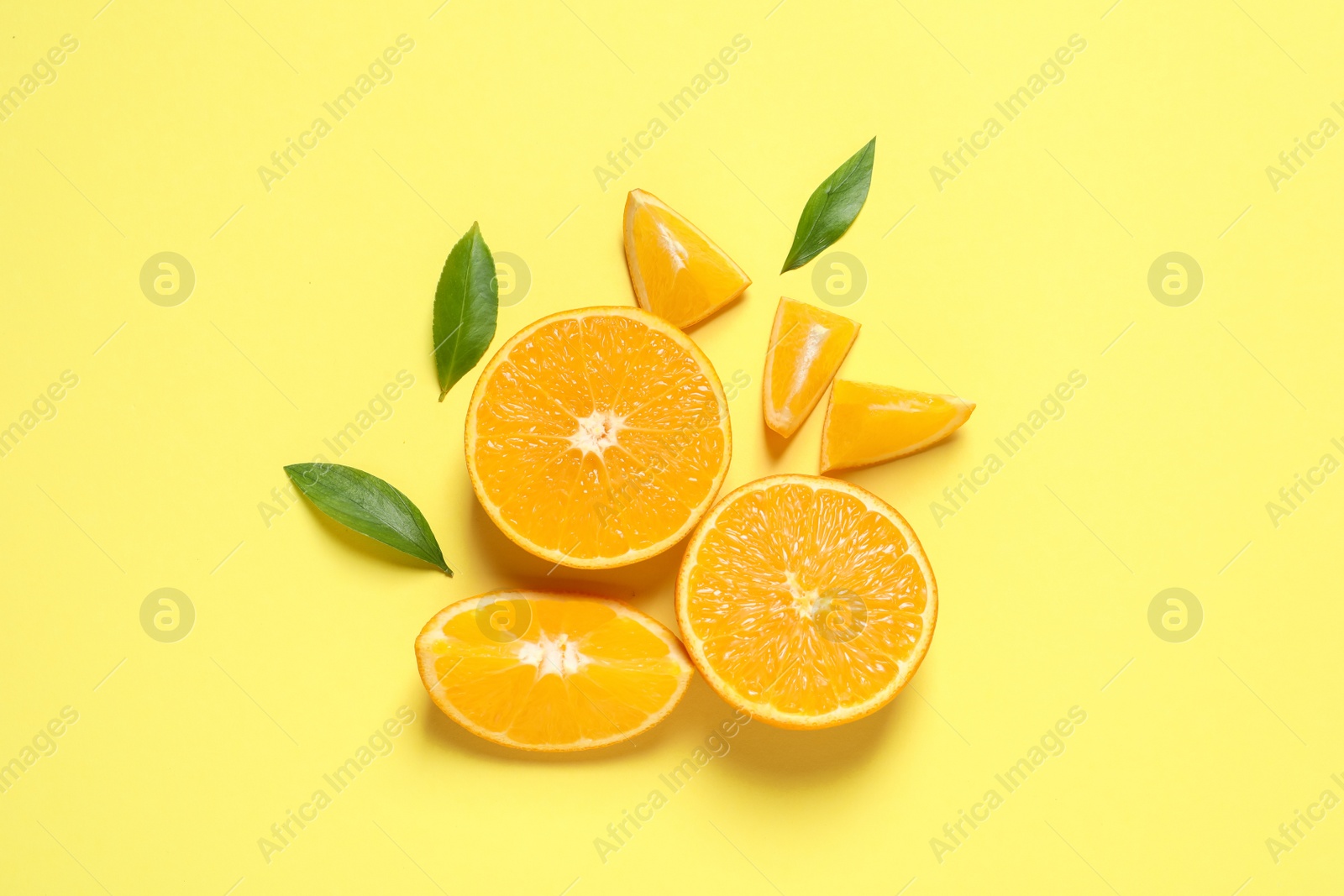 Photo of Flat lay composition with ripe oranges on color background