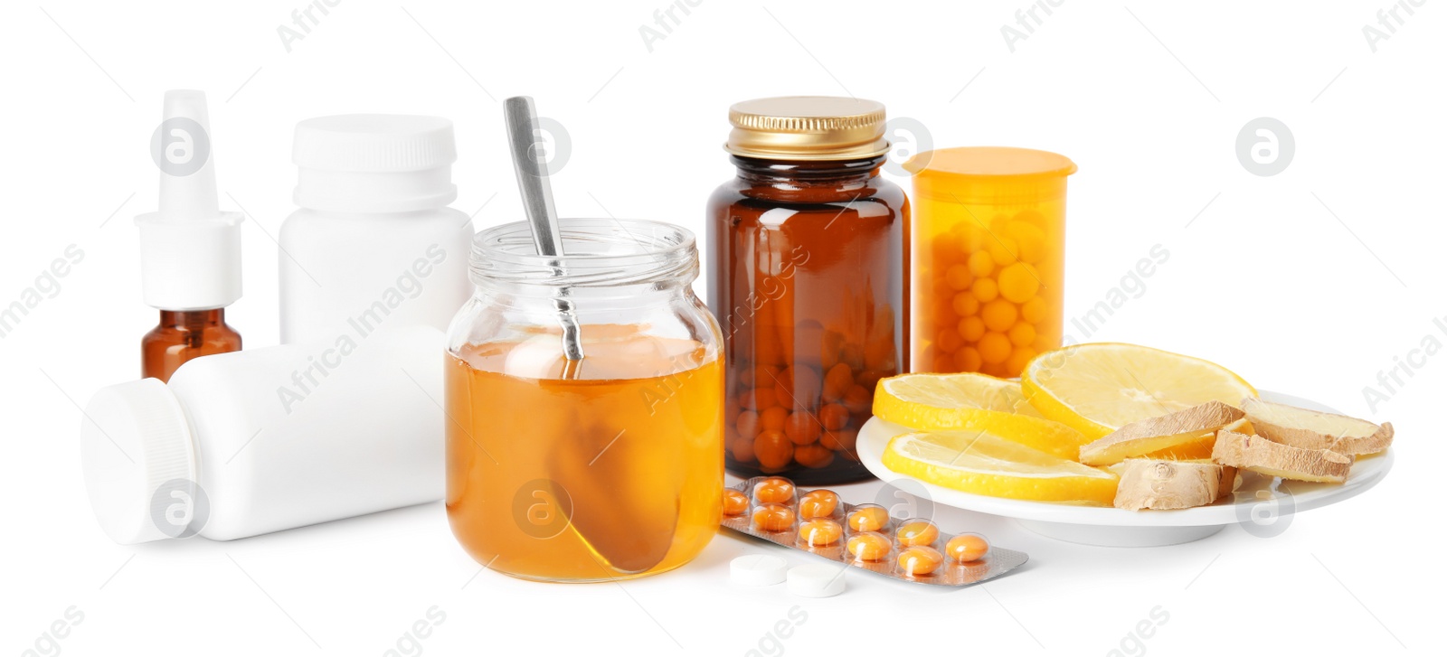 Photo of Natural and medical cold remedies on white background
