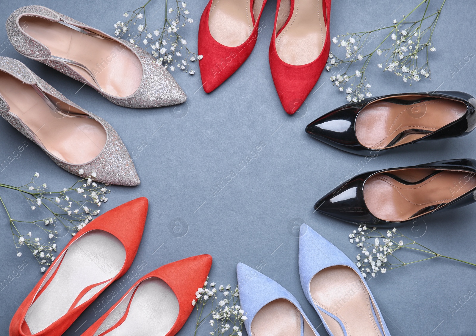 Photo of Flat lay composition with stylish female shoes on grey background. Space for text