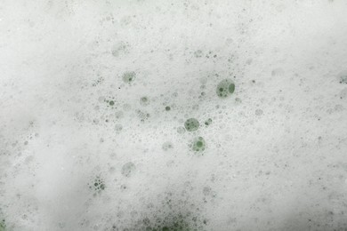 Photo of Fluffy soap foam as background, closeup view